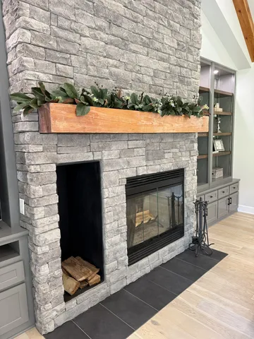 a kitchen with kitchen island granite countertop a sink a center island stainless steel appliances and cabinets