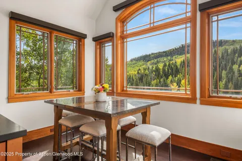 a bedroom with bed couch and window