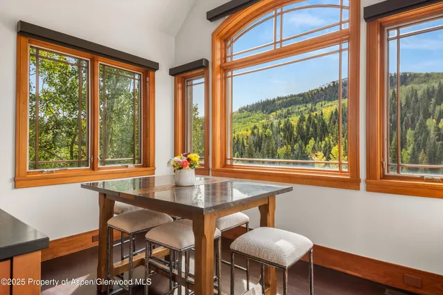 a bedroom with bed couch and window