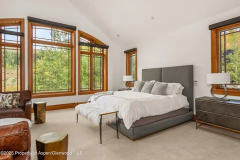 a bathroom with a granite countertop sink and a large mirror