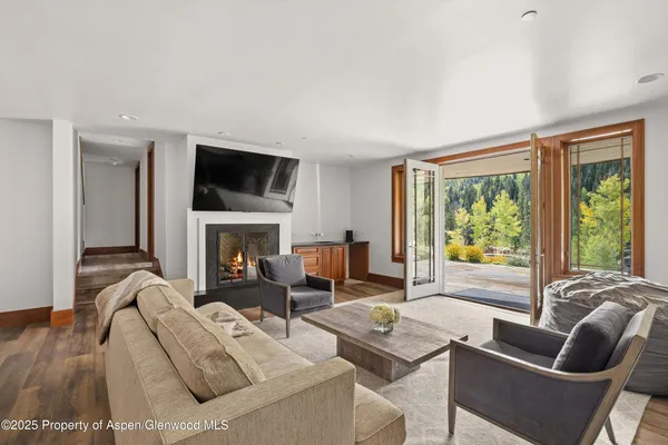 a room with pool table and flat screen tv