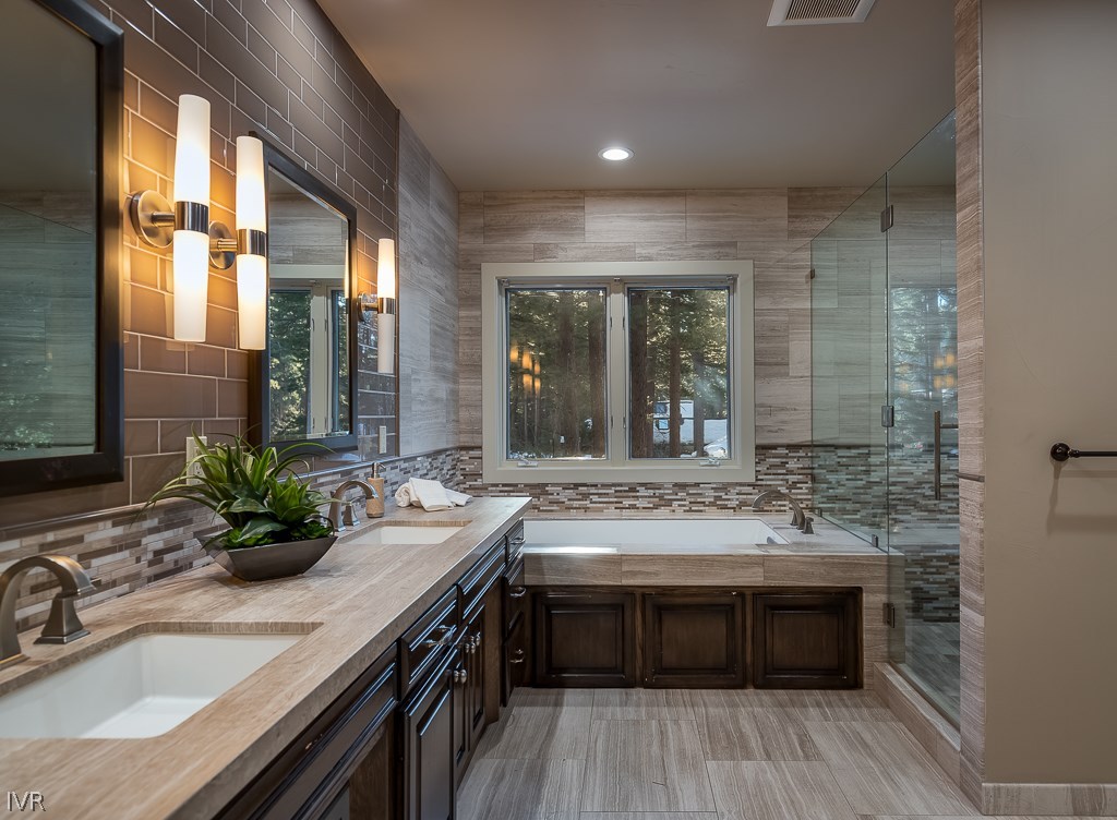 818 Ophir Peak Road Incline Village, NV 89451 - Photo 11 of 23 a bathroom with a granite countertop sink a large mirror and a