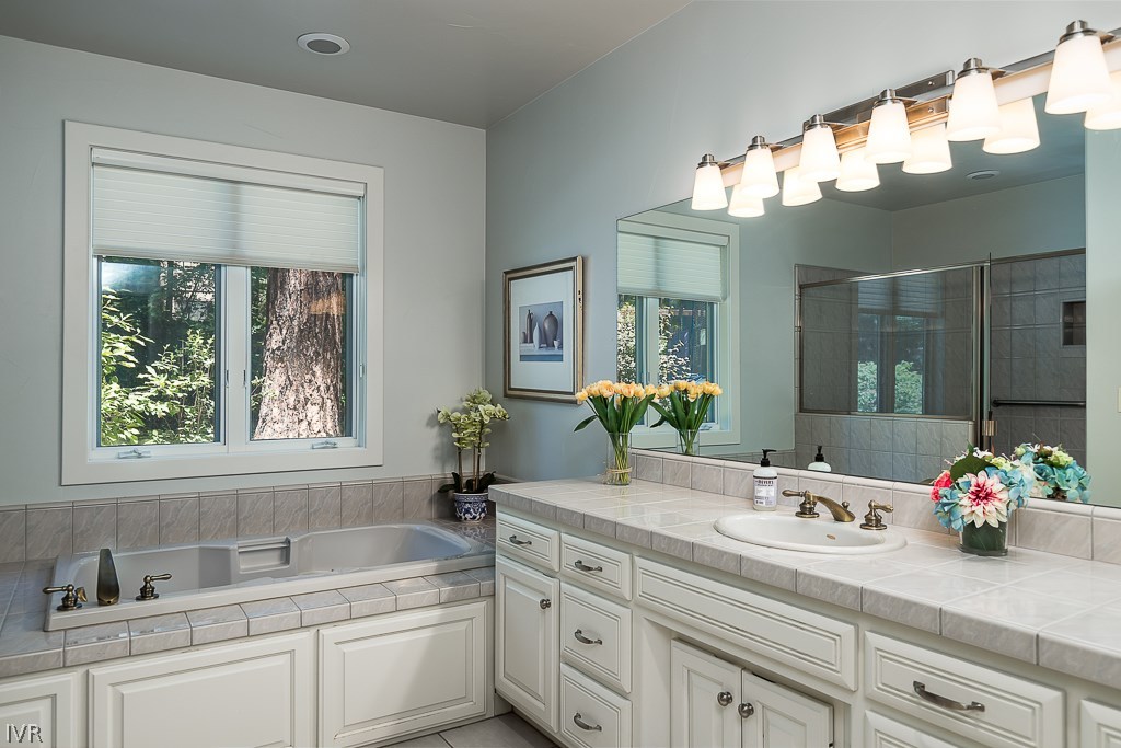 818 Ophir Peak Road Incline Village, NV 89451 - Photo 19 of 23 a bathroom with a sink double vanity and a mirror