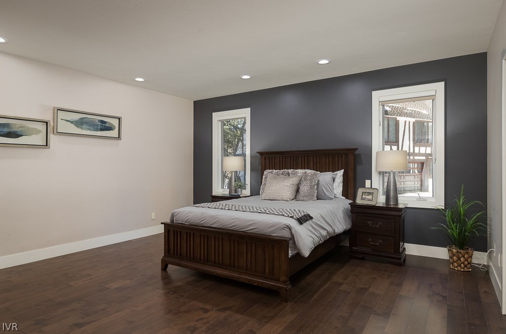 818 Ophir Peak Road Incline Village, NV 89451 - Photo 9 of 23 a spacious bedroom with a bed and a potted plant