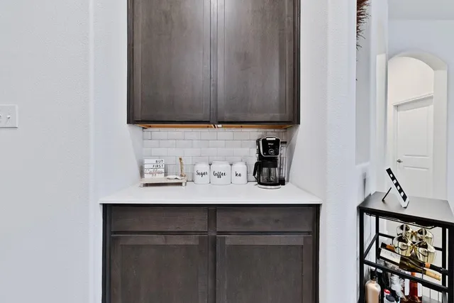 a kitchen with a cabinets and a stove top oven