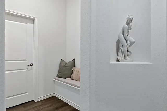 a room that has a window and wooden floor