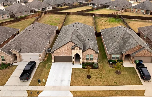 an aerial view of a house with swimming pool
