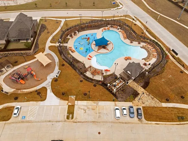with white bath tub sitting next to a blue sink