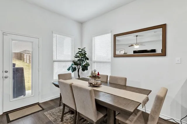 a dining room with furniture and window