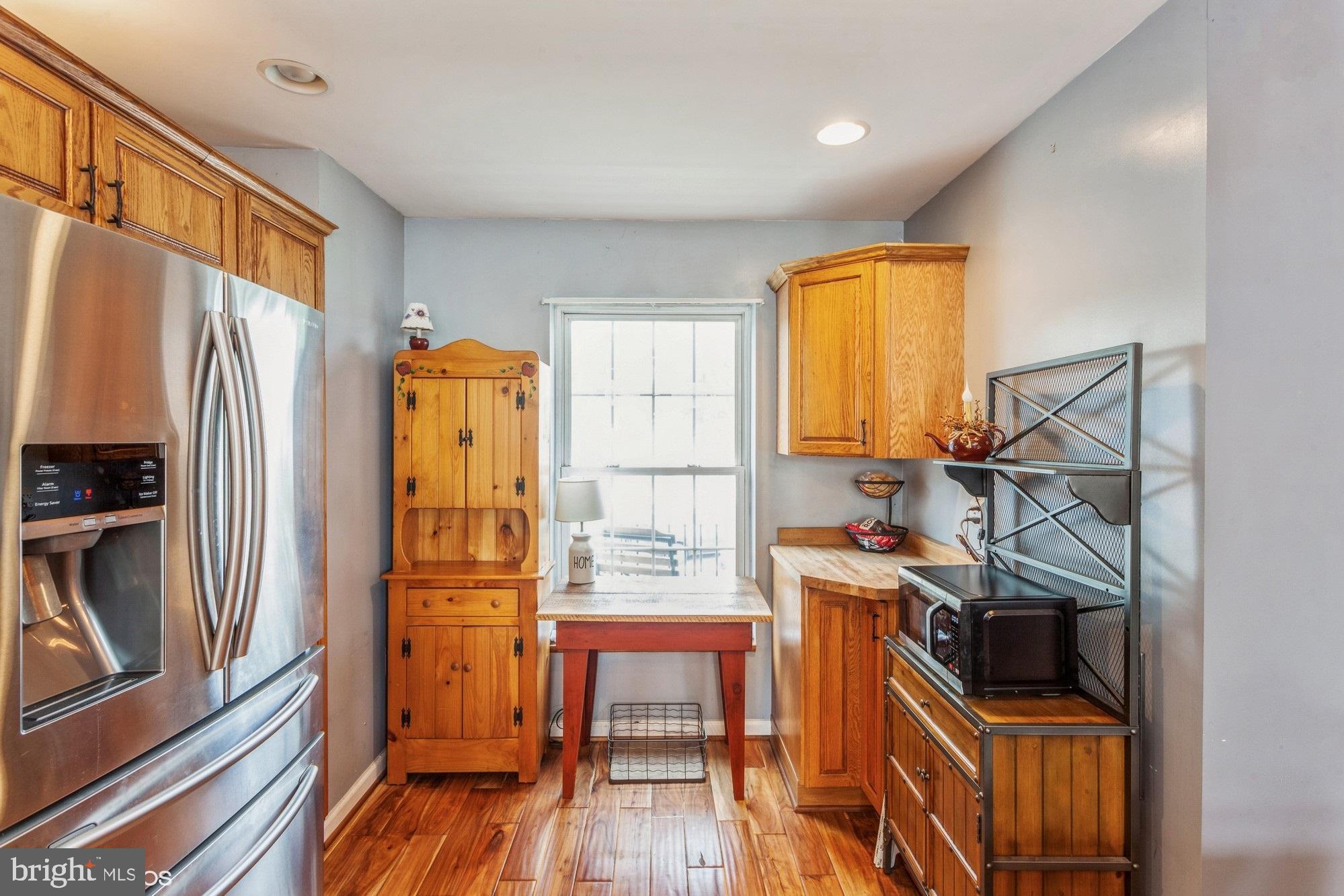 2425 Golupski Road Essex, MD 21221 - Photo 9 of 48 a view of a kitchen with furniture and wooden floor