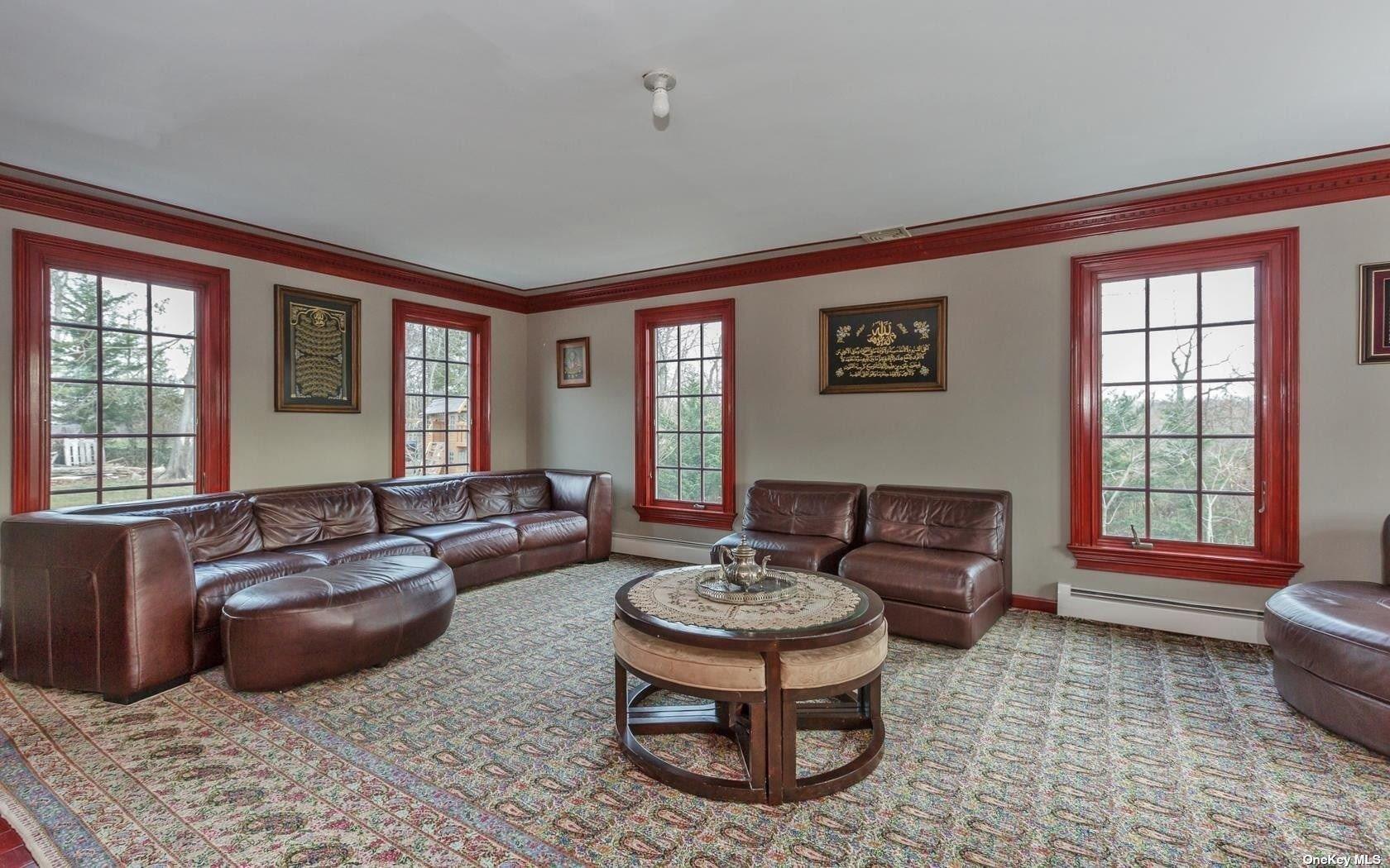 7 Old Field Road Setauket, NY 11733 - Photo 18 of 33 a living room with furniture and a large window
