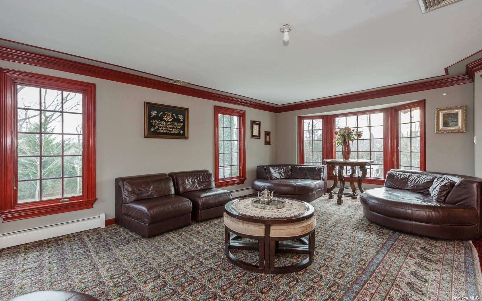 7 Old Field Road Setauket, NY 11733 - Photo 19 of 33 a living room with furniture and a window