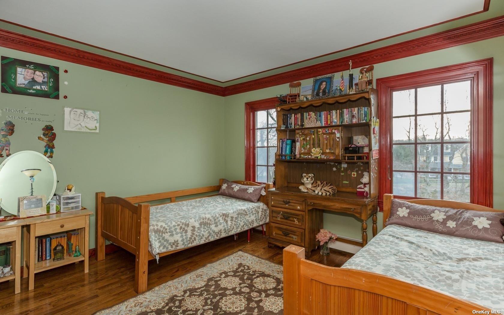 7 Old Field Road Setauket, NY 11733 - Photo 22 of 33 a bedroom with a bed and a window