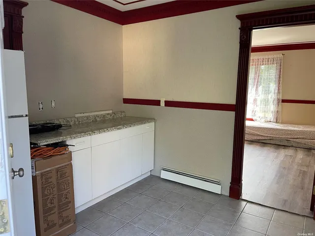 a utility room with cabinets washer and dryer