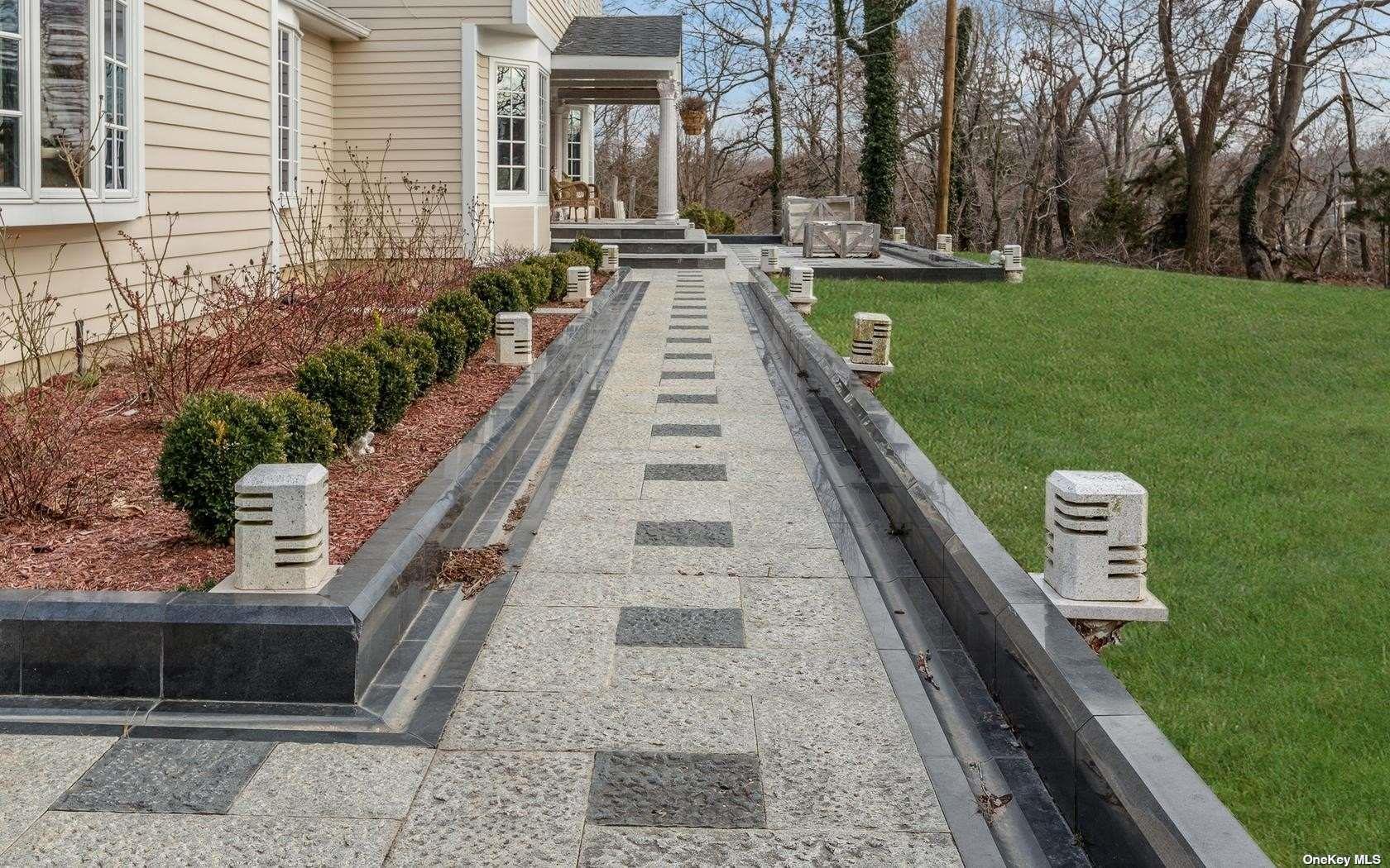 7 Old Field Road Setauket, NY 11733 - Photo 4 of 33 a view of a backyard with sitting area
