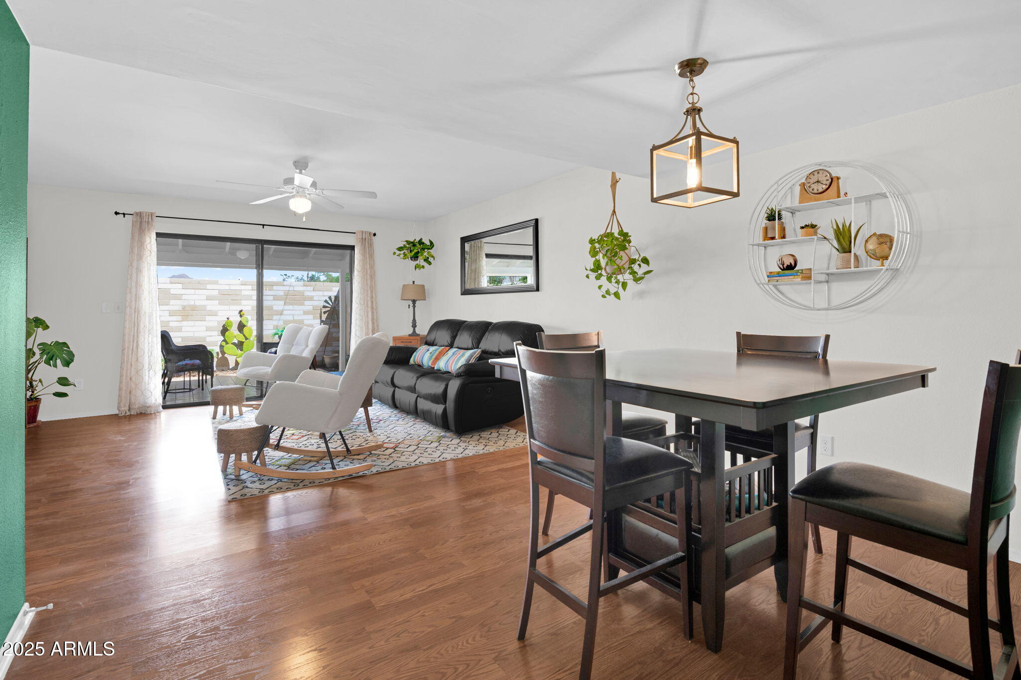 5315 North 18th Street, Unit 9 Phoenix, AZ 85016 - Photo 8 of 27 a view of a dining room with furniture window and wooden floor
