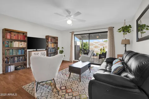 a view of a dining room with furniture wooden floor and a chandelier