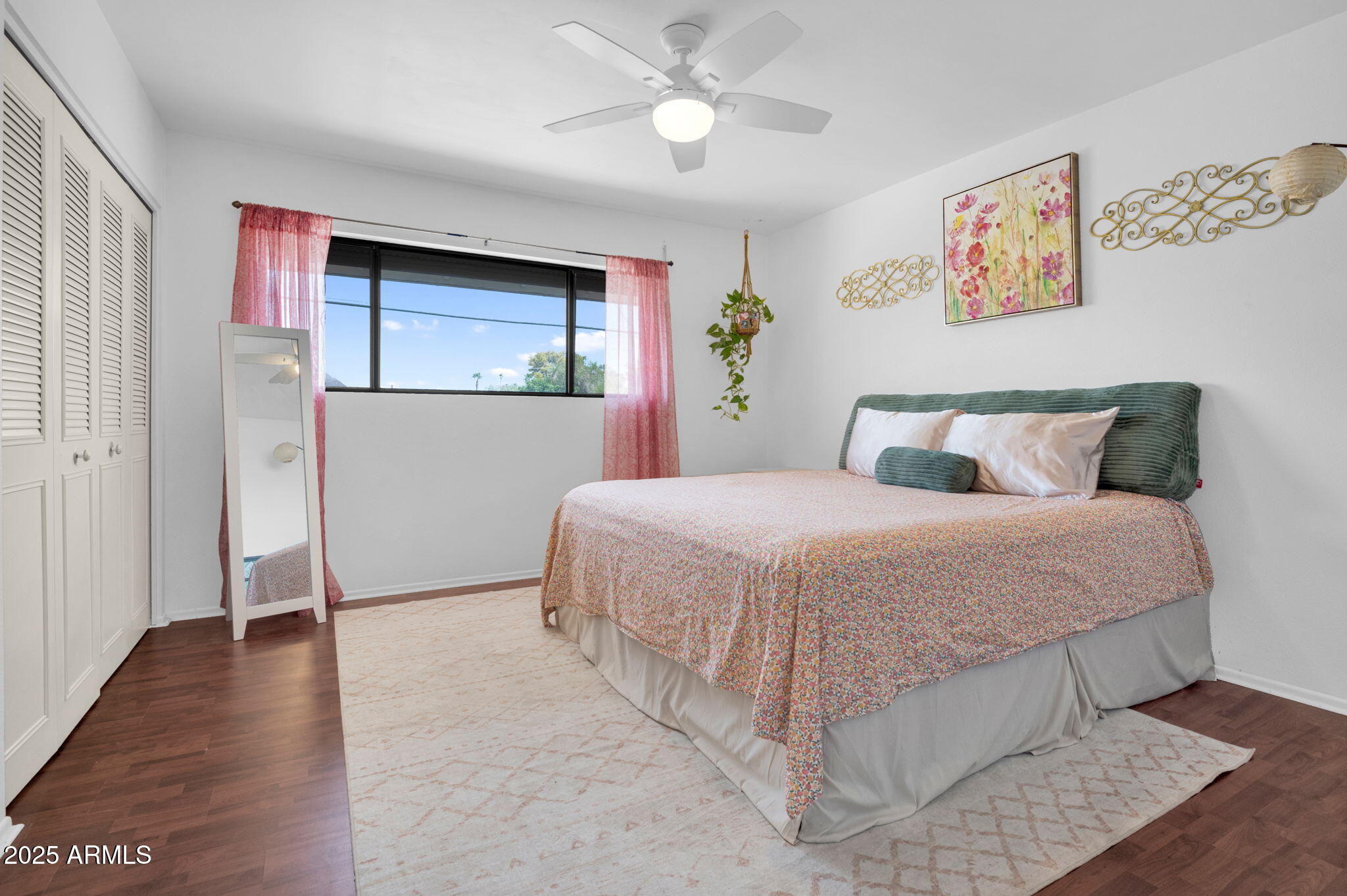 5315 North 18th Street, Unit 9 Phoenix, AZ 85016 - Photo 12 of 27 a bedroom with a bed and a painting on the wall