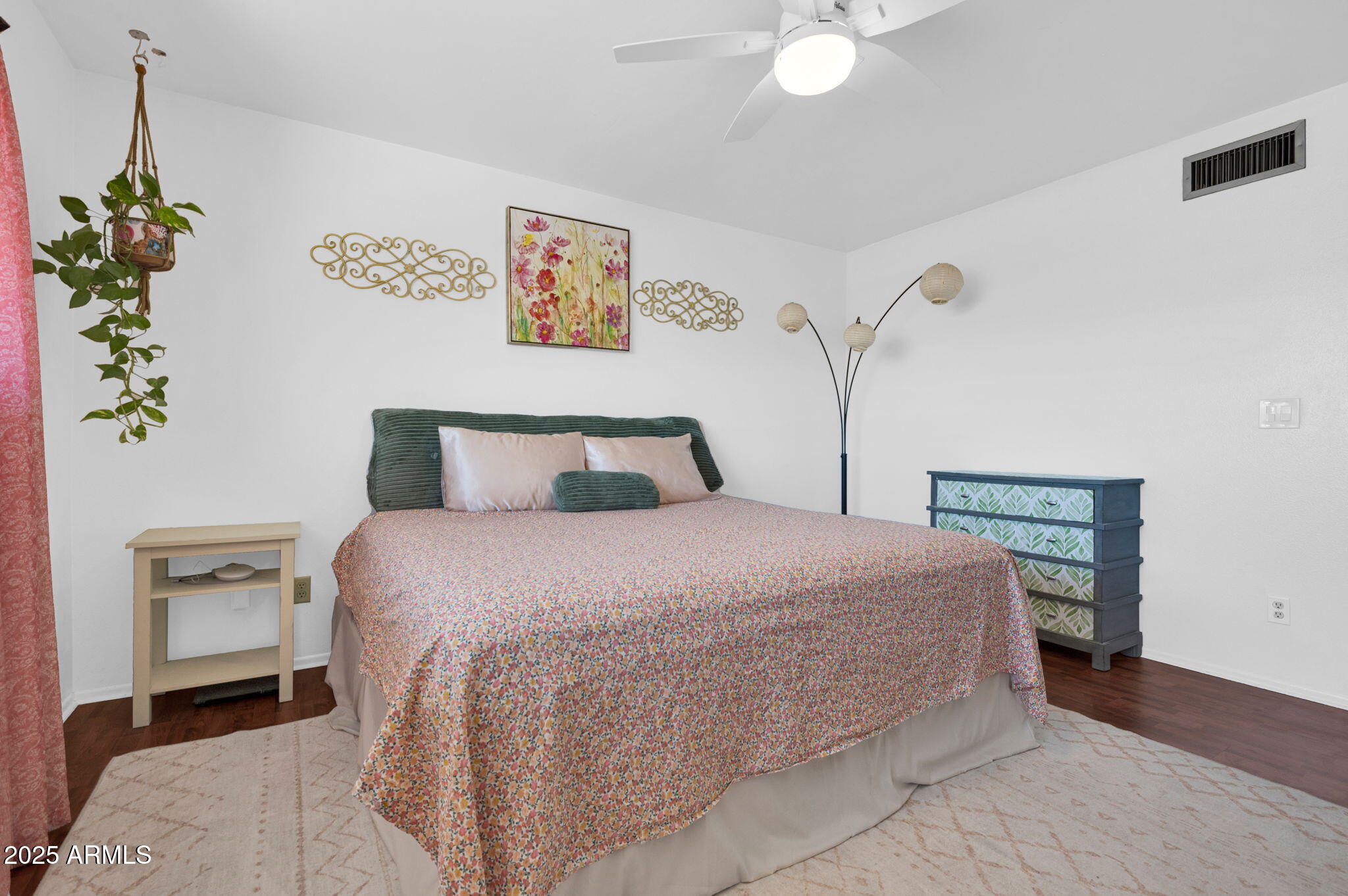 5315 North 18th Street, Unit 9 Phoenix, AZ 85016 - Photo 13 of 27 a bedroom with a bed and a chandelier