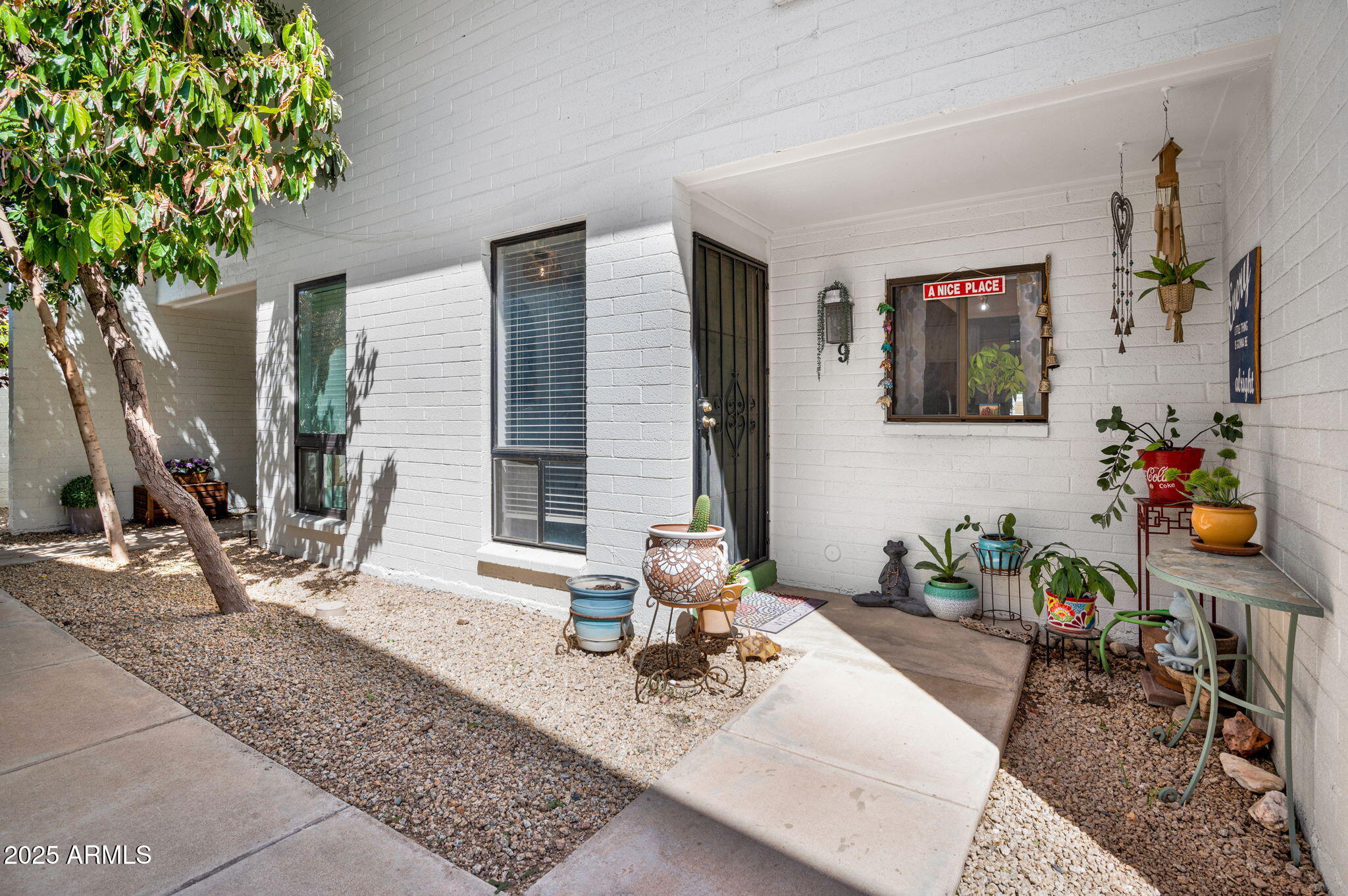 5315 North 18th Street, Unit 9 Phoenix, AZ 85016 - Photo 2 of 27 a vase of flowers sitting on a table