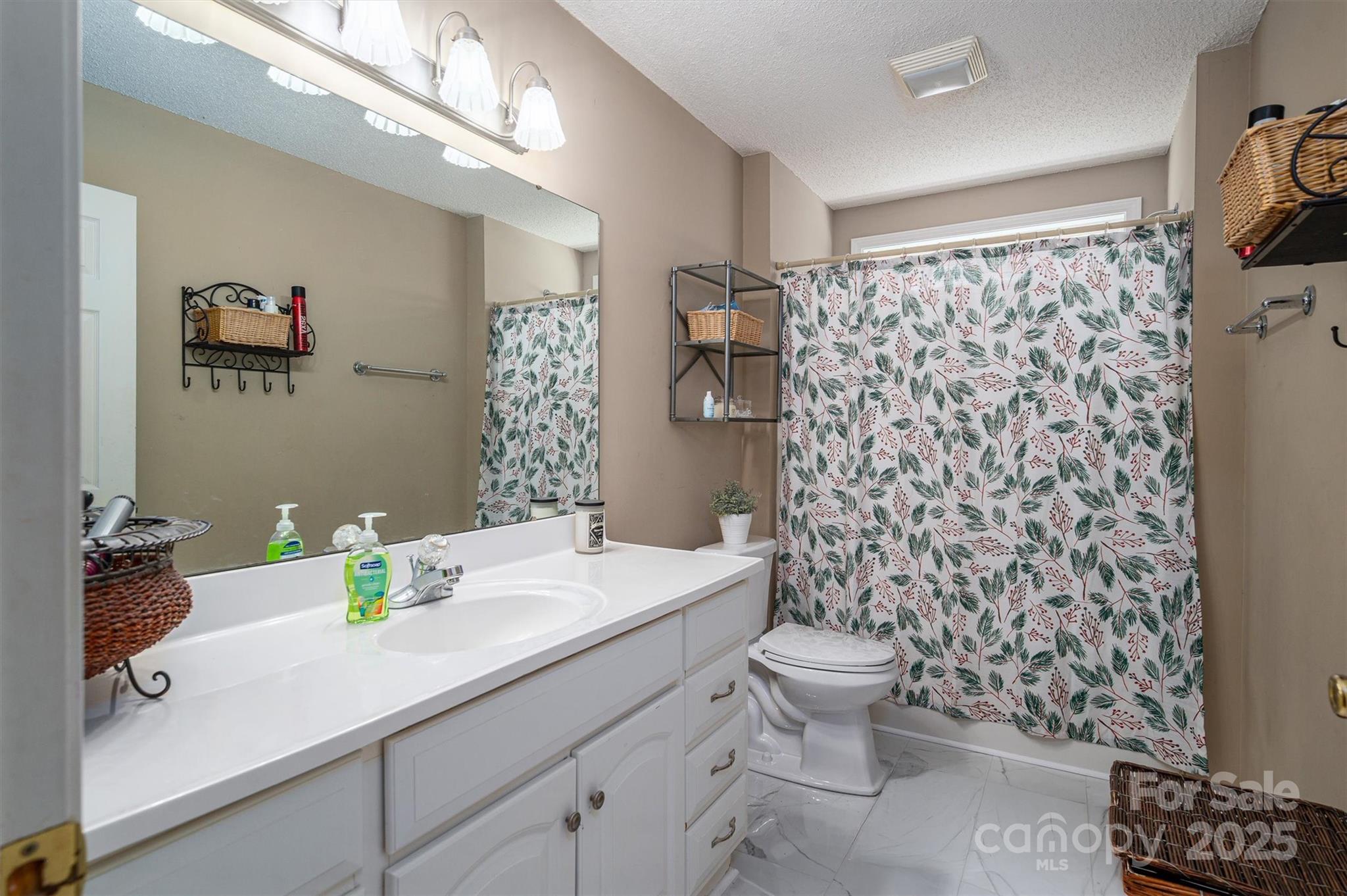 1335 Huckleberry Road Lincolnton, NC 28092 - Photo 20 of 24 a bathroom with a sink toilet and shower