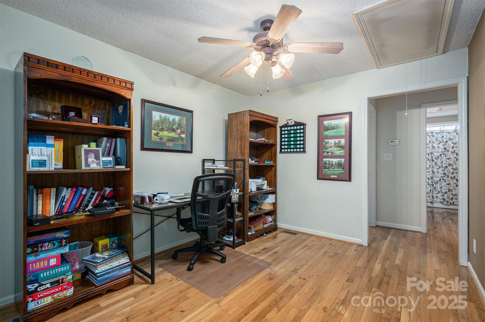1335 Huckleberry Road Lincolnton, NC 28092 - Photo 21 of 24 a view of a workspace with bookshelf and a window