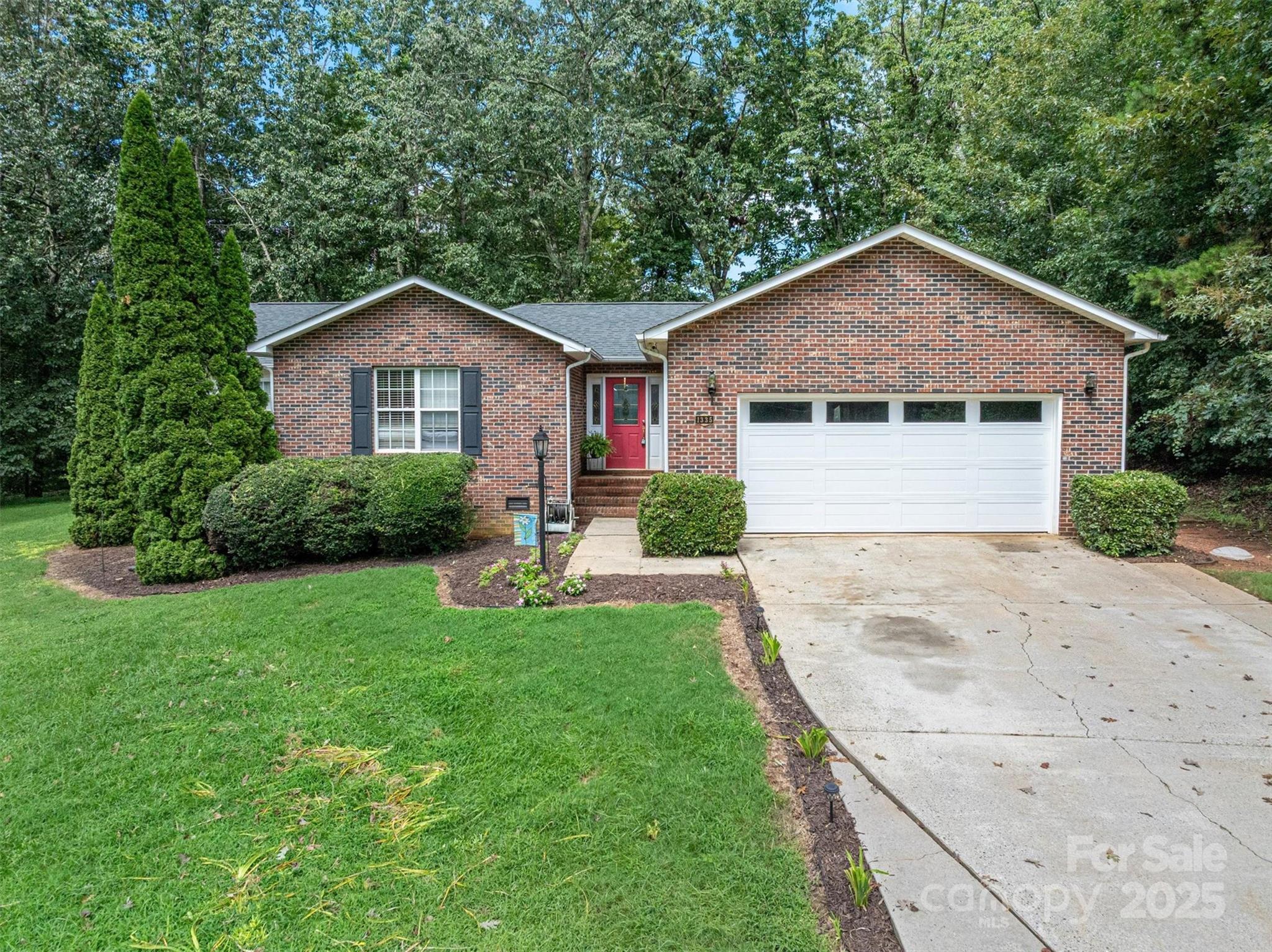 1335 Huckleberry Road Lincolnton, NC 28092 - Photo 24 of 24 a house view with a garden space