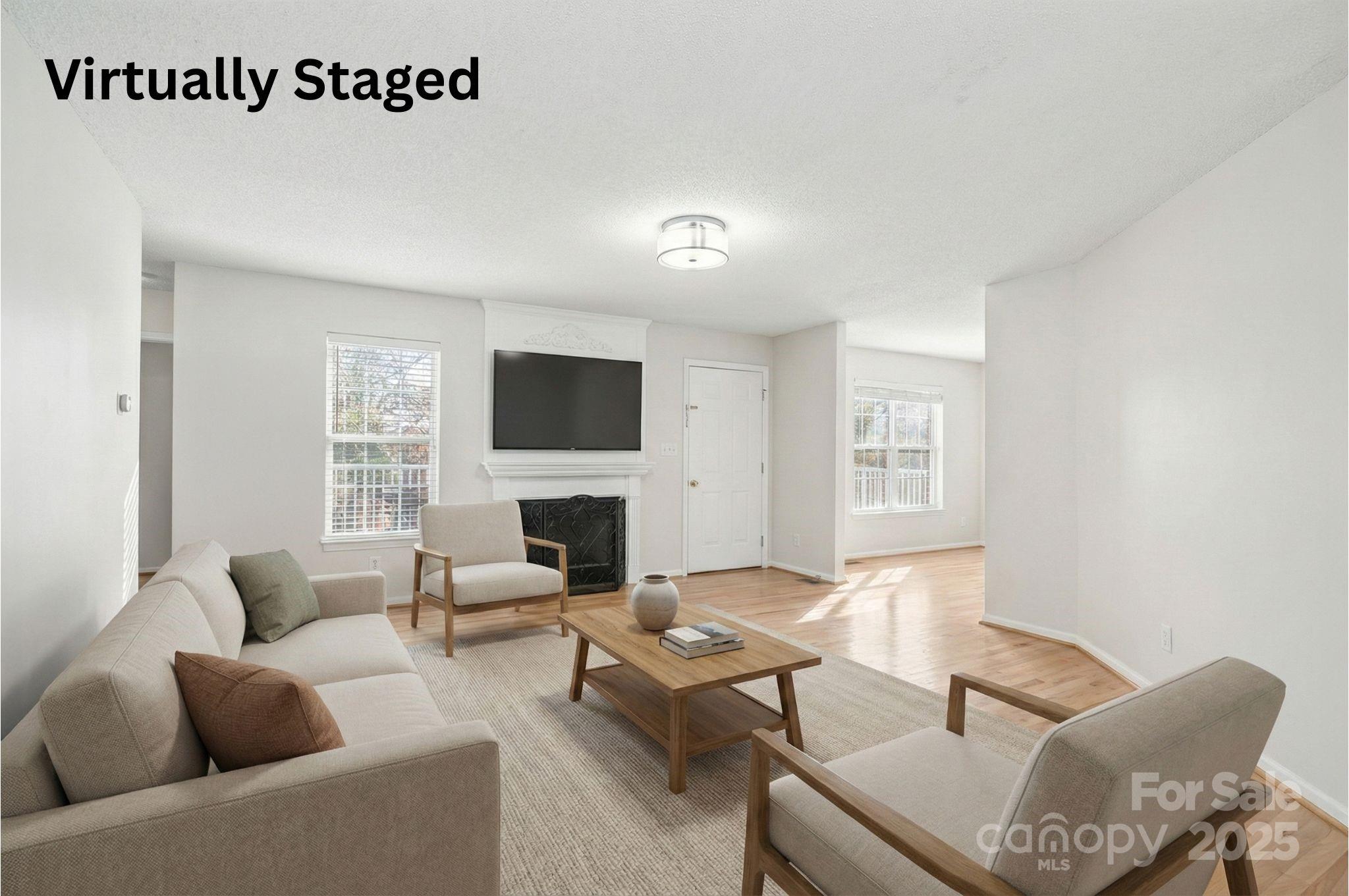 1335 Huckleberry Road Lincolnton, NC 28092 - Photo 3 of 24 a living room with furniture wooden floor and a fireplace