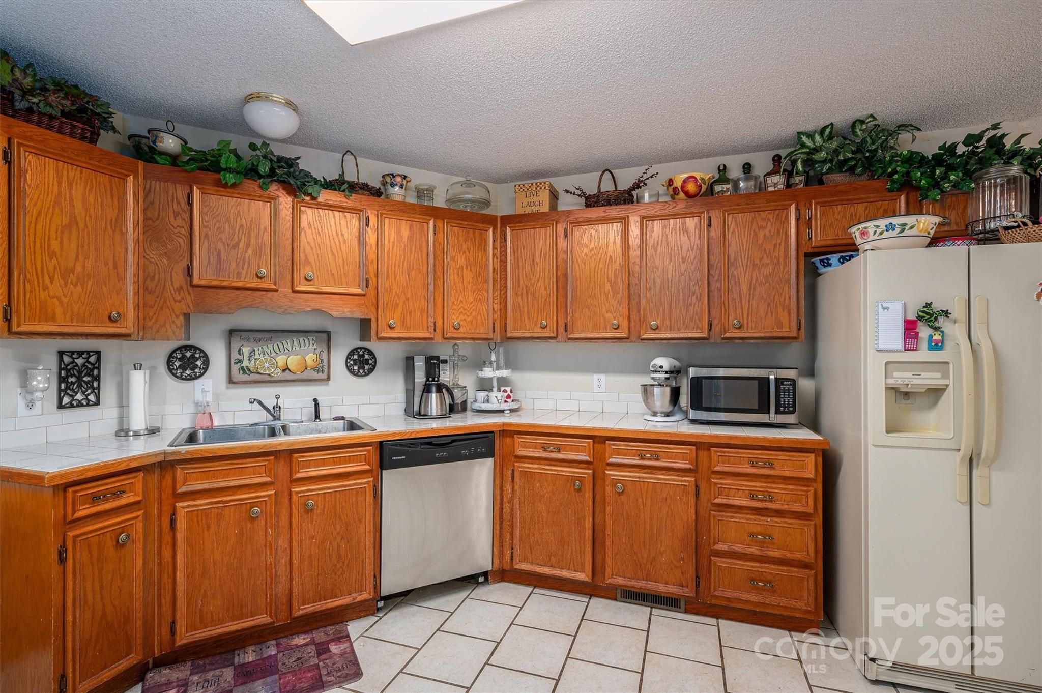 1335 Huckleberry Road Lincolnton, NC 28092 - Photo 7 of 24 a kitchen with a sink dishwasher stove and cabinets