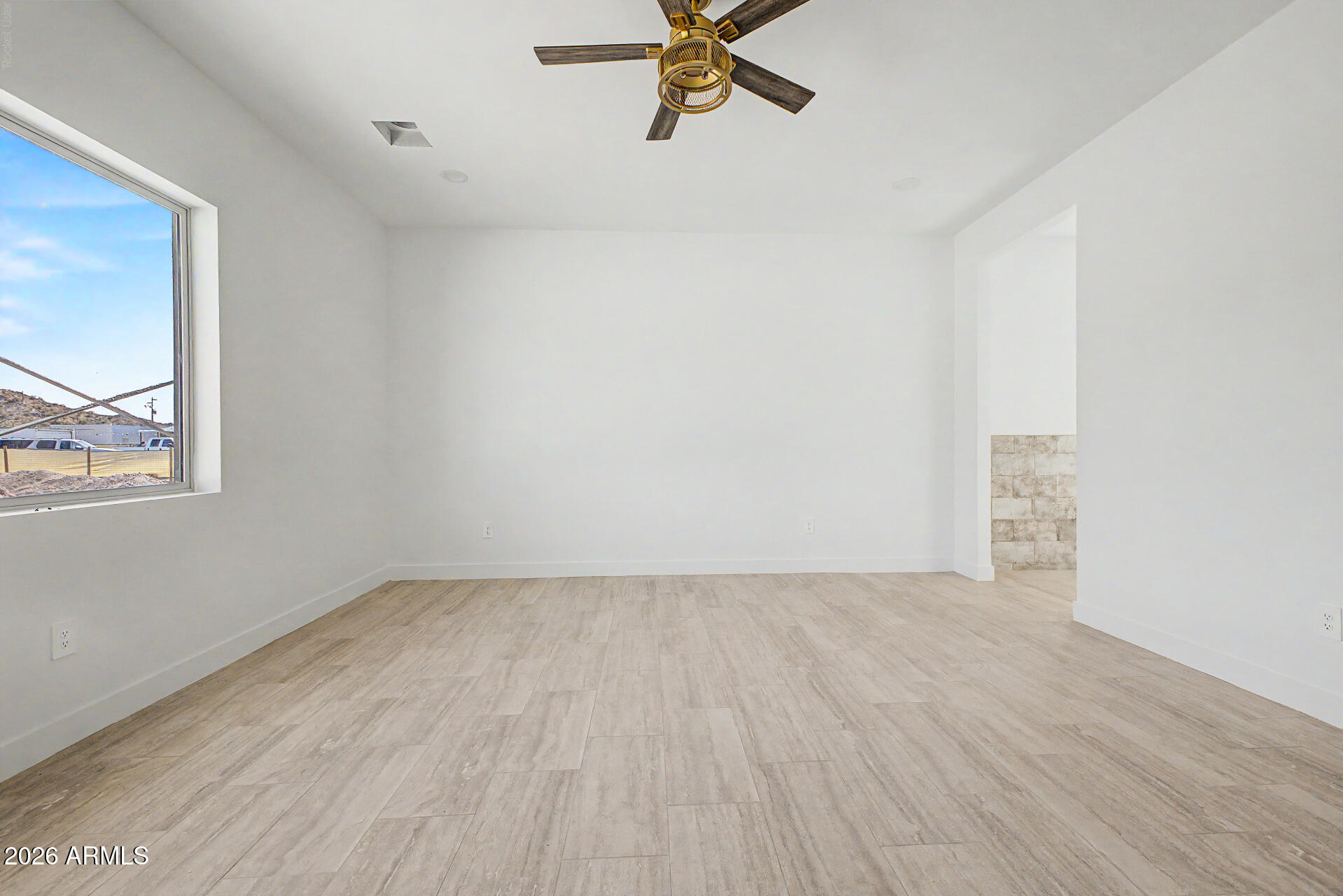 18815 West Arlington Road Buckeye, AZ 85326 - Photo 25 of 56 a view of an empty room with a window