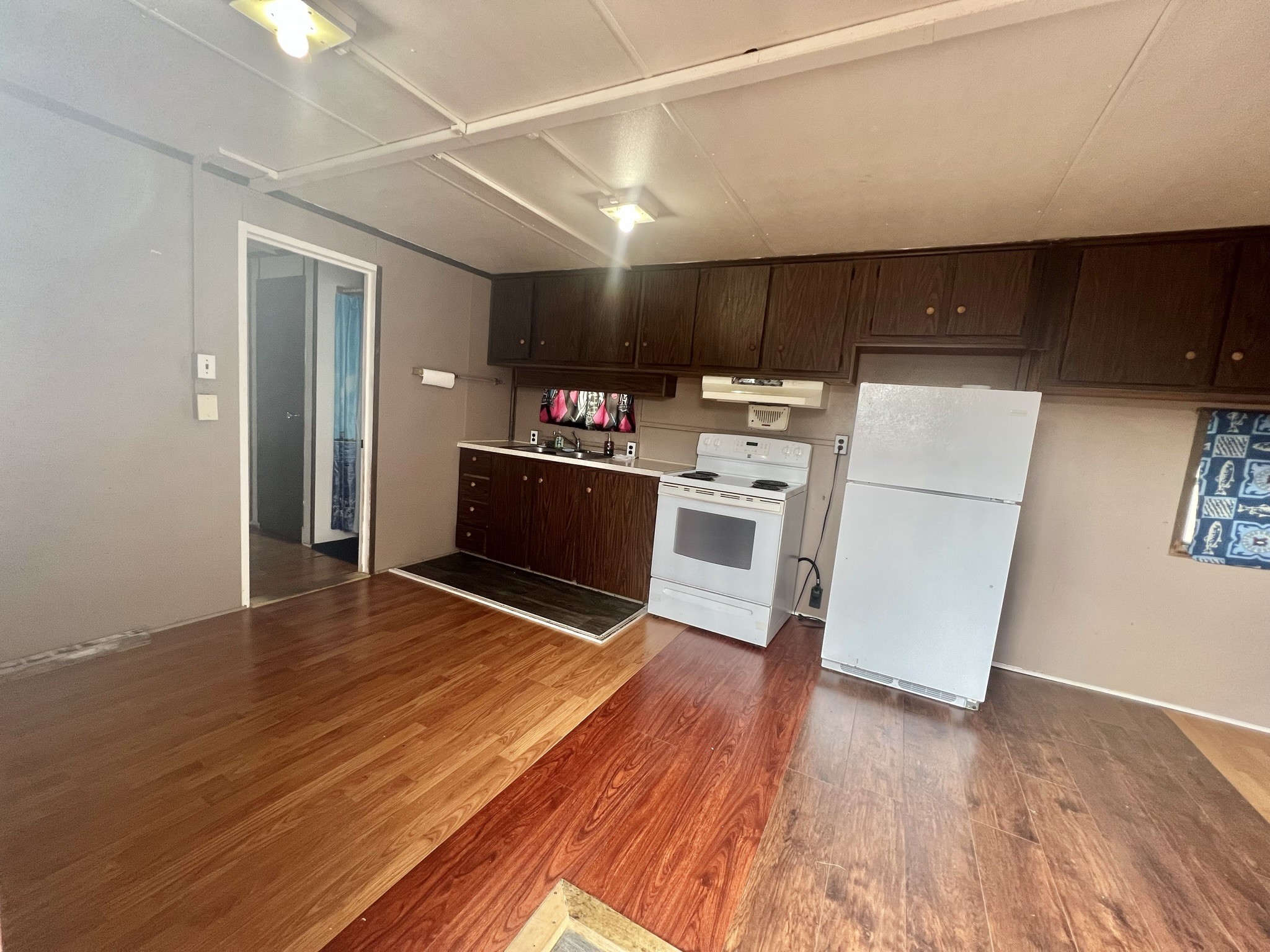 2749 Wagon Trail Road Pearland, TX 77584 - Photo 10 of 18 a kitchen with stainless steel appliances a refrigerator and wooden floor