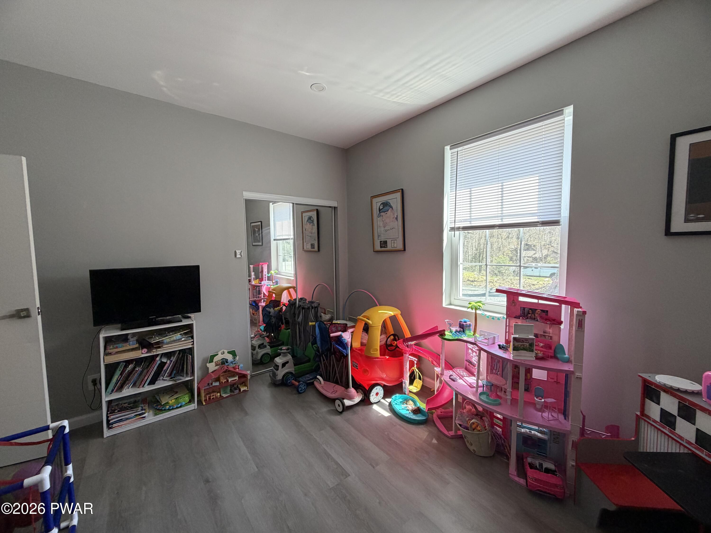 801 Maple Ridge Court Hawley, PA 18428 - Photo 32 of 55 a play room with toys and a flat screen tv