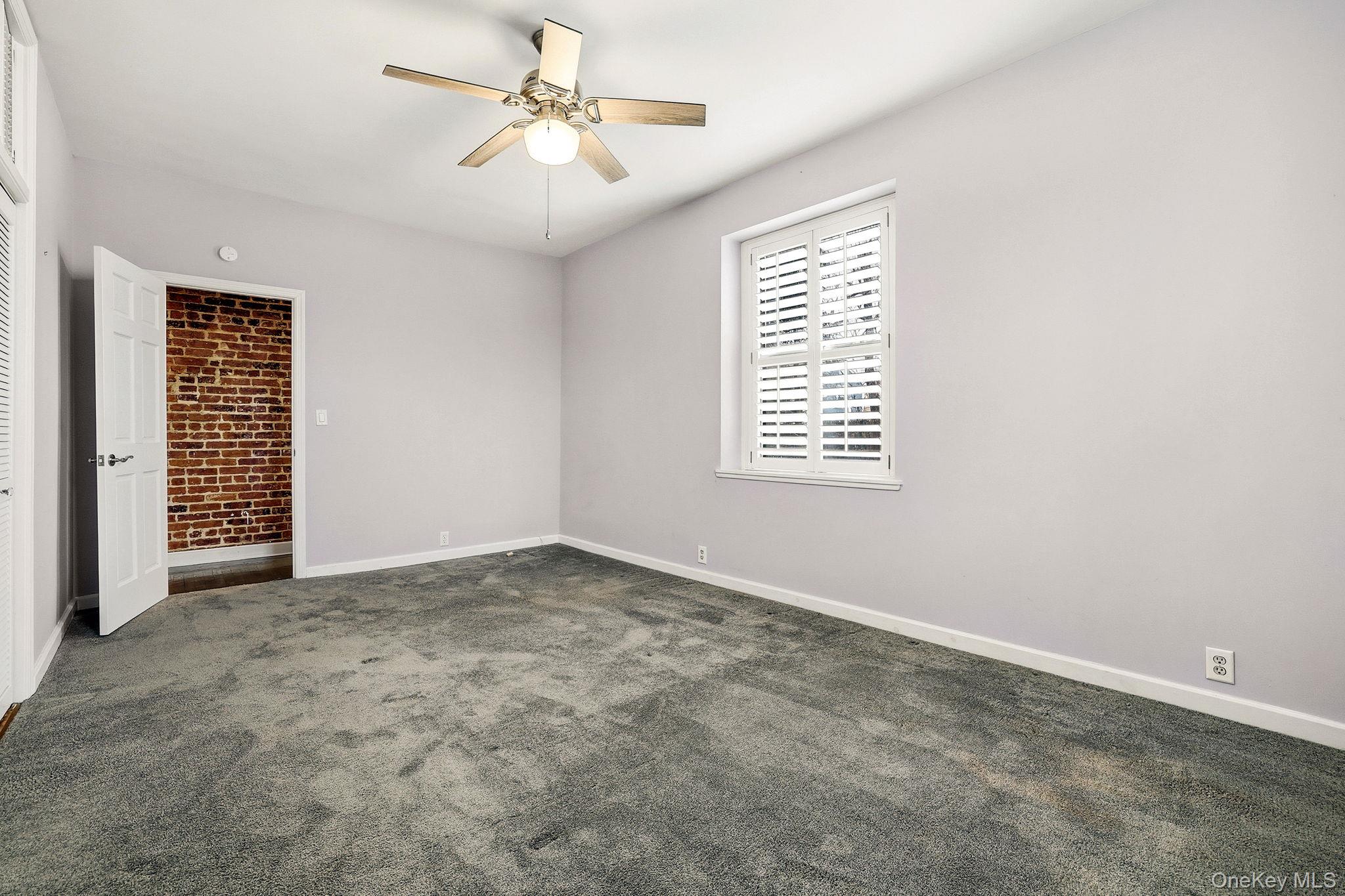 11 Alden Road, Unit 1M Larchmont, NY 10538 - Photo 20 of 25 an empty room with windows and fan