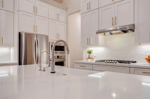 a spacious bedroom with a bed and a window