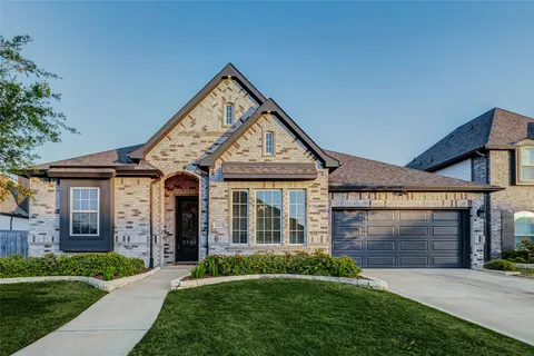 a living room with furniture a window and a flat screen tv