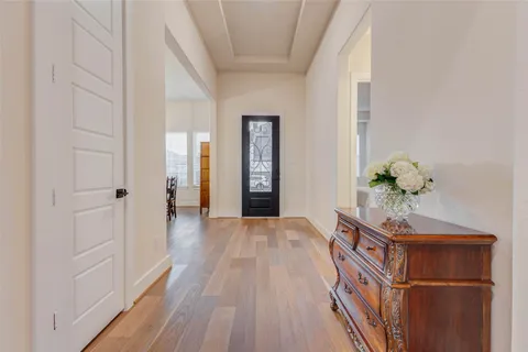 a living room with furniture a flat screen tv and a large window
