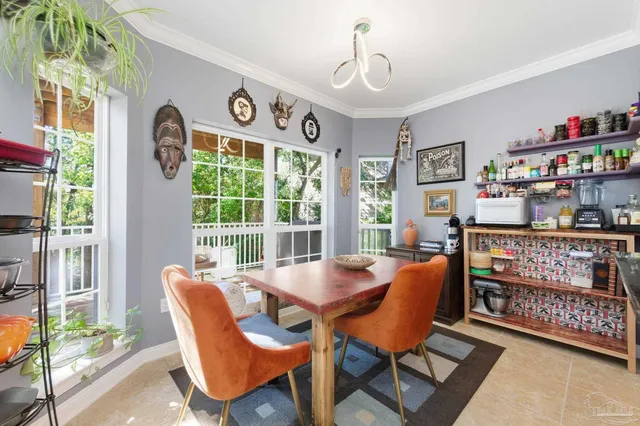 a view of a dining room with furniture window and outside view