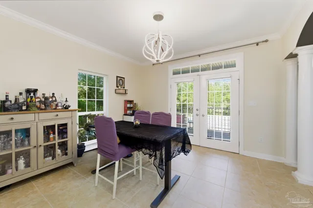 a view of a dining room with furniture window and outside view
