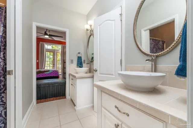 a bathroom with a toilet and a window