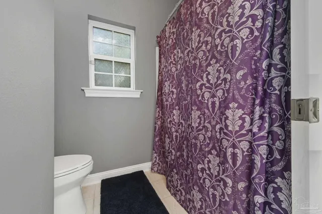 a bedroom with a bed and a desk