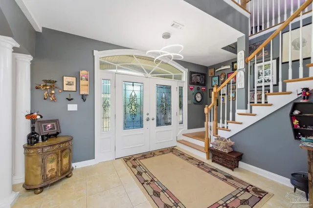 a view of an entryway with front door