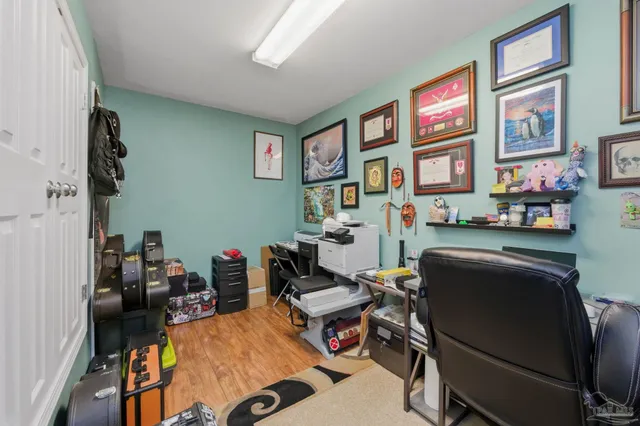 a bedroom with a bed dresser and a window