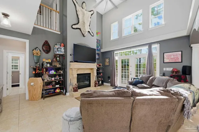 a living room with fireplace furniture and a flat screen tv