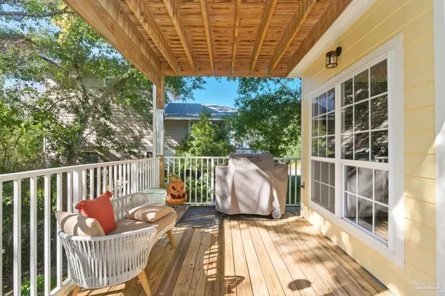 a view of a balcony with potted plants
