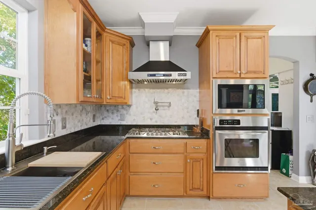 a dining room with furniture and a window
