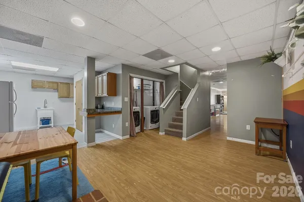 a room with furniture and wooden floors