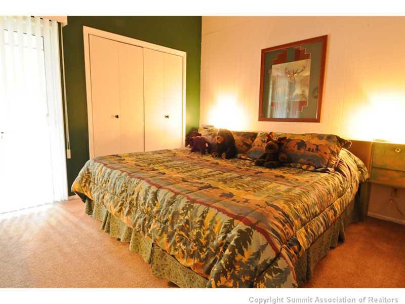 1977 Soda Ridge Road, Unit 1212 Keystone, CO 80435 - Photo 13 of 25 a bedroom with a bed and a painting on the wall