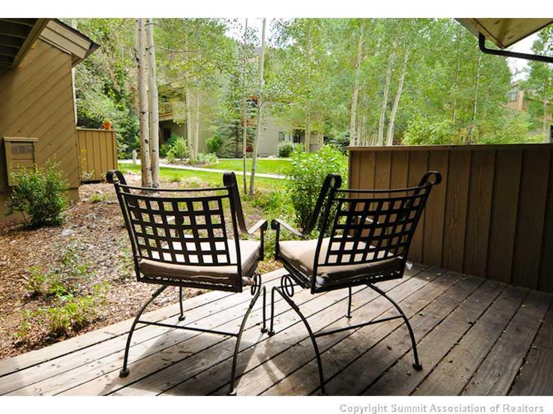 1977 Soda Ridge Road, Unit 1212 Keystone, CO 80435 - Photo 18 of 25 a view of a chairs and table in patio