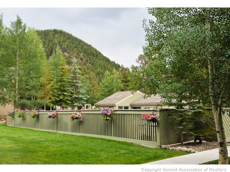 1977 Soda Ridge Road, Unit 1212 Keystone, CO 80435 - Photo 22 of 25 a swimming pool with trees in the background