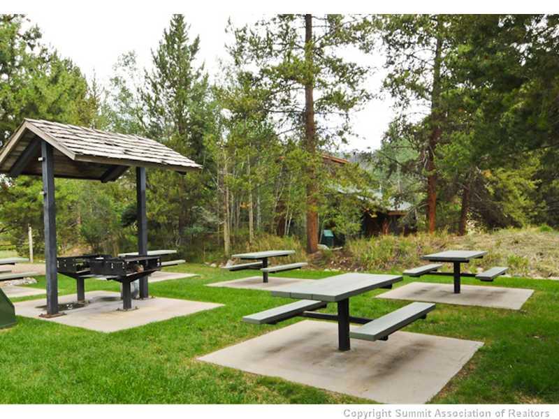 1977 Soda Ridge Road, Unit 1212 Keystone, CO 80435 - Photo 25 of 25 a park bench sitting in the middle of a park